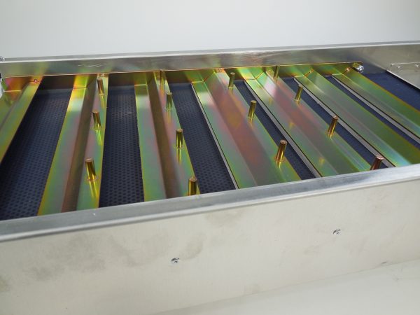 A stainless steel tray with metal strips in the Rake Riffle for Royal Gold Rake Riffle Only Recovery box sold with Complete unit.