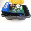 A Miller Table Recovery Gold Dust Concentrating Table with tools and supplies in it.
